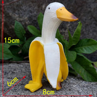 Statue of a duck hatching out of a peeled banana