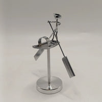 Metal fisherman balancing sculpture for a desk
