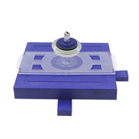 Magnetic levitating spinning top hovering above its base