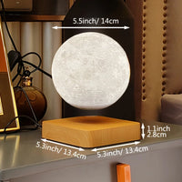 Moon lamp levitating and rotating above a wooden base